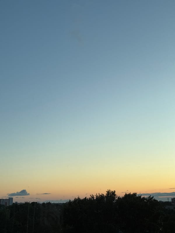 City sunset tracked across an evening sky