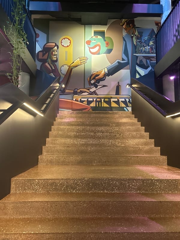 Exploring ornate multi-level marketplace with murals and industrial design