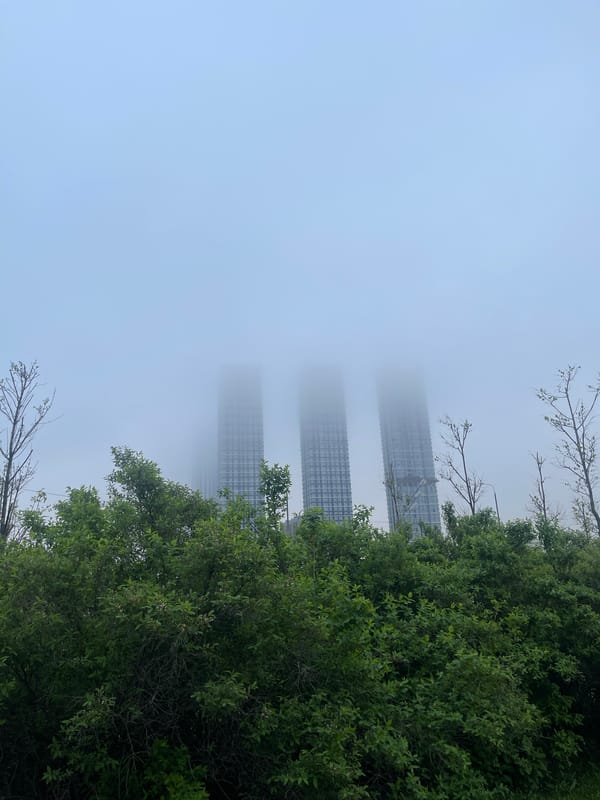 Fog envelops Moscow skyscrapers in early morning scene