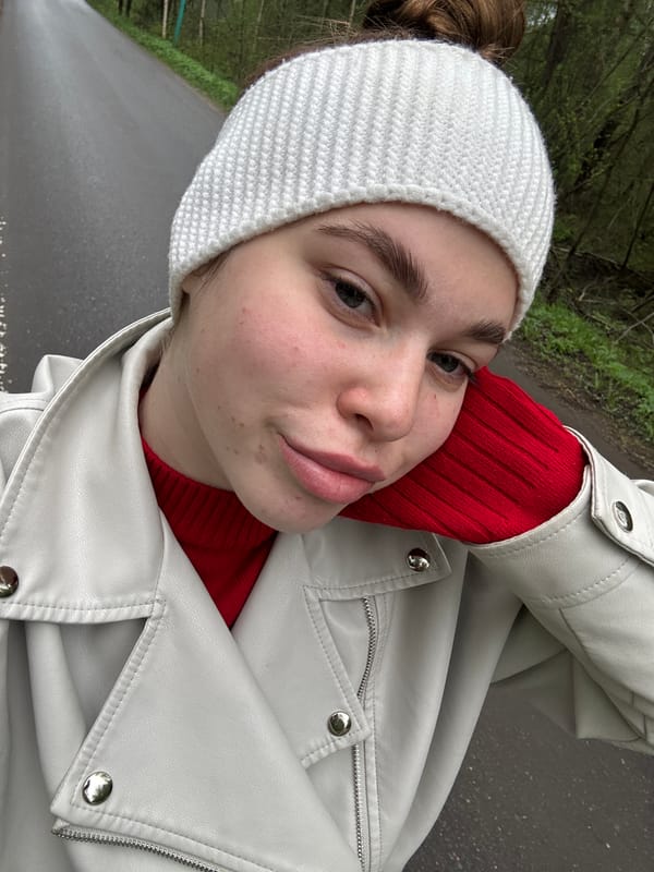 Woman photographed in rural Russian village during morning outing
