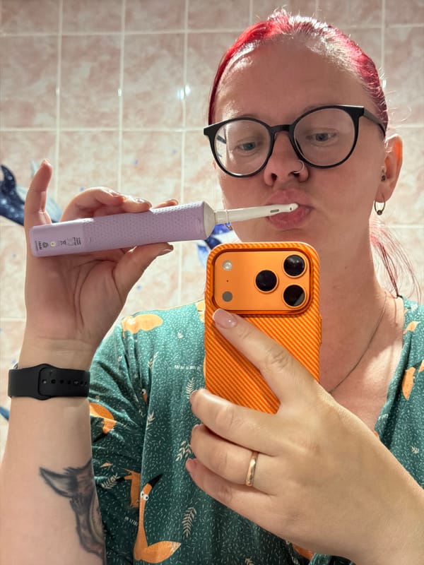 Woman multitasks dental hygiene and selfie in Russian bathroom