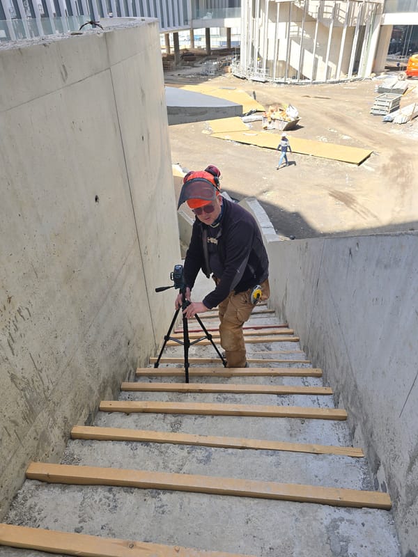 Construction worker observed on unfinished building balcony