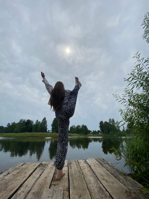 Yoga and quiet moments on a rural Russian pier