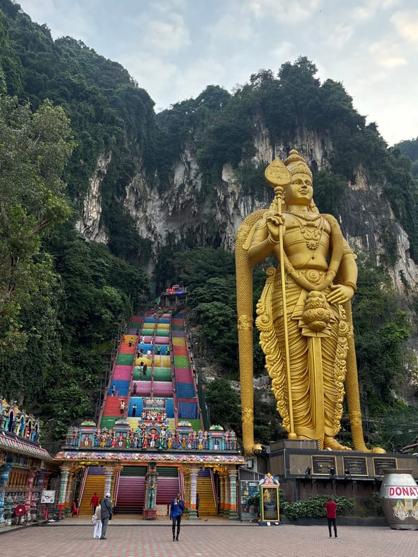 Golden statues, vivid temple architecture, and wildlife at a Selayang Hindu complex