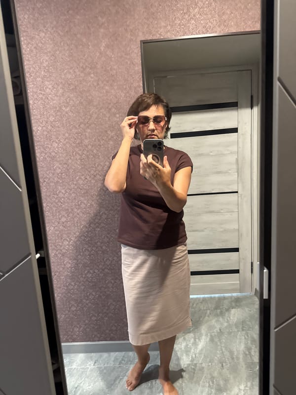 Mirror selfies in a Солонешное hallway, summer 2026