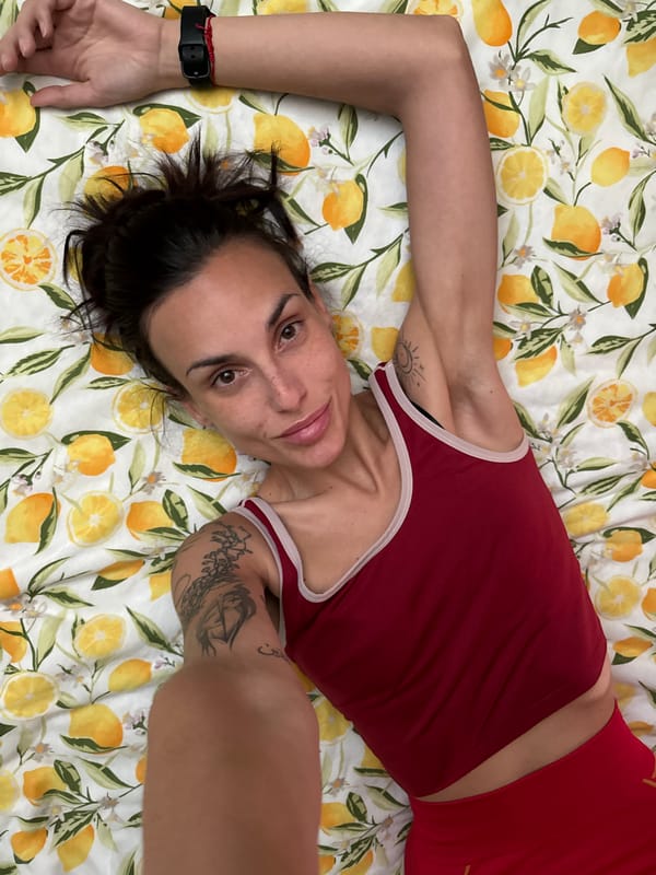 Person photographed on lemon-patterned bed in Pleven, Bulgaria
