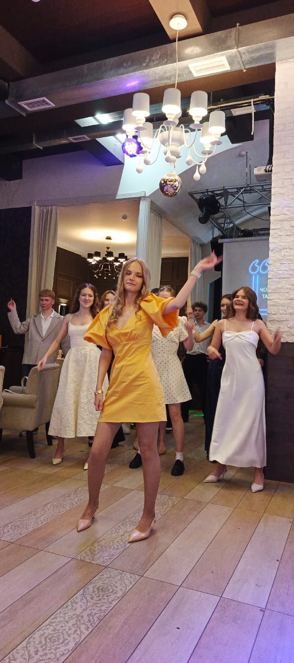 Formal celebration and dancing at a venue in Chaikovsky, Russia
