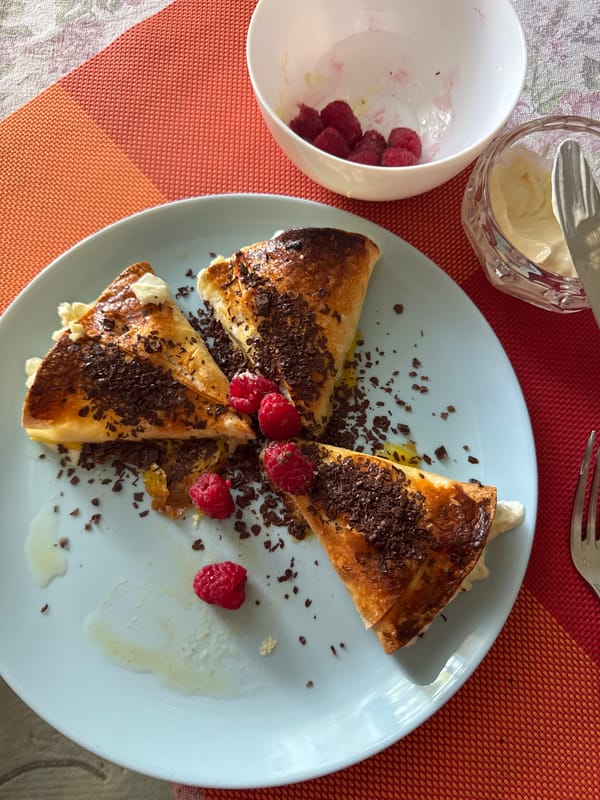 Breakfast table spread with pastries and fresh fruit, Chernivtsi