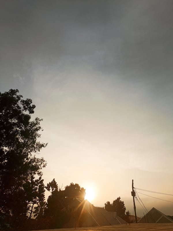 Daily life documented in Bukuru, Nigeria during sunset hours