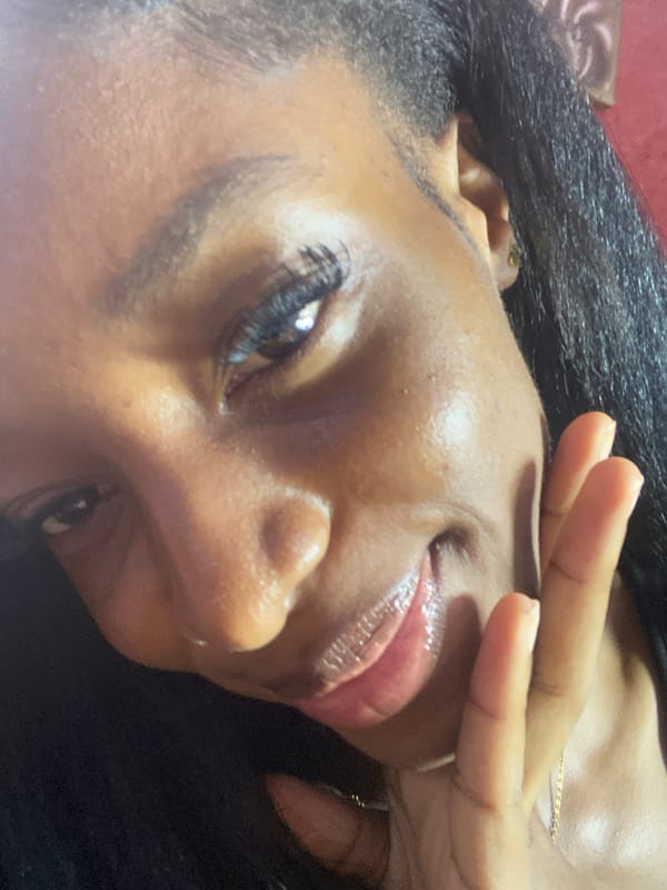 Woman takes selfies during indoor gathering in Jos, Nigeria