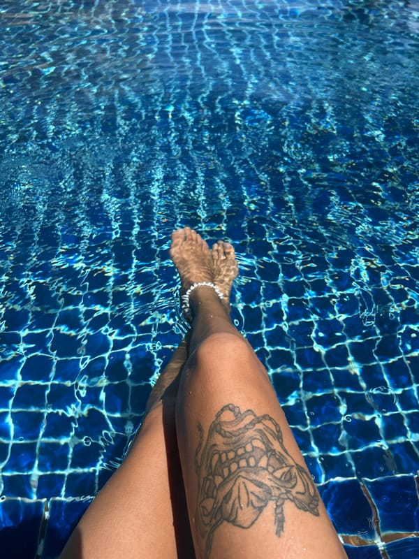 Poolside morning in Phuket with palms, sand, and coconuts