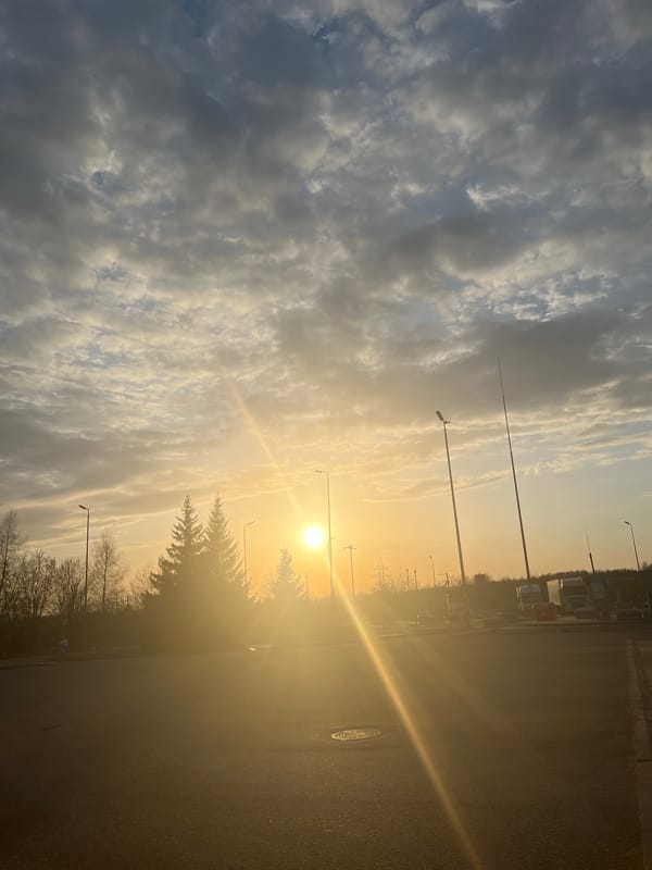 Car refueling at gas station during sunset in Klin