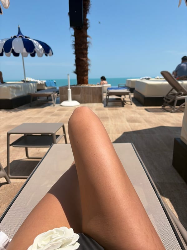 Woman sunbathes at Varna resort terrace