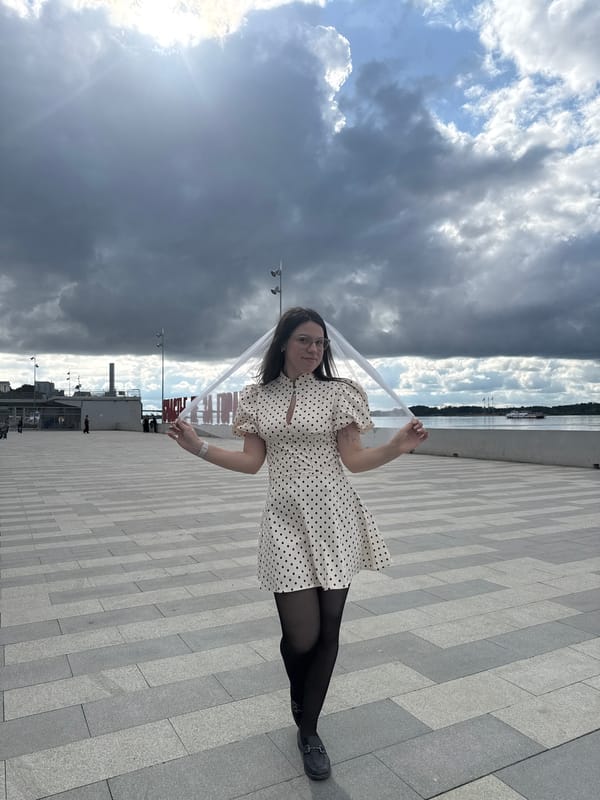 Woman in polka-dot dress photographed around Perm, Russia