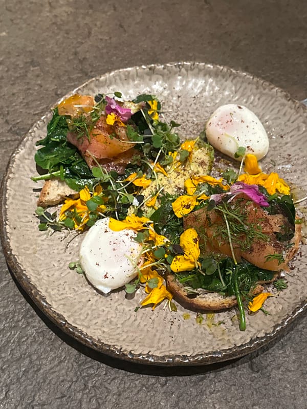 Two women share healthy meal at Madrid restaurant