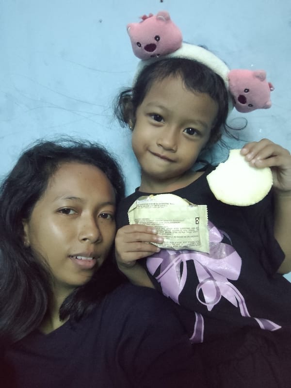 Selfies and snack time against a light blue wall