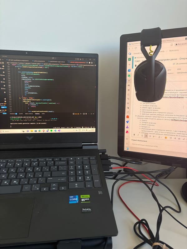 Software developer works at dual-screen setup in Varna, Bulgaria