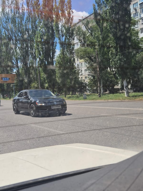 Everyday traffic moving through Kropyvnytskyi streets on a clear morning