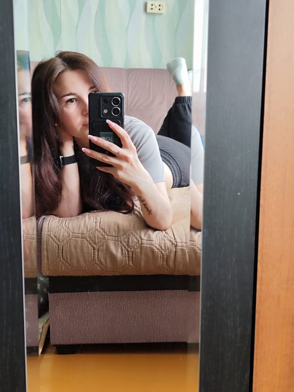 Woman documents morning routine with selfies and breakfast in Fokino