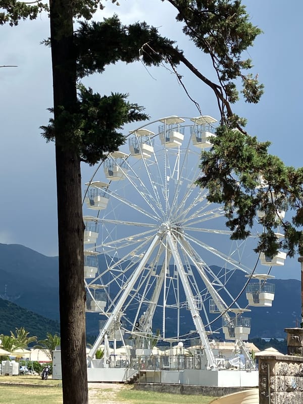 Afternoon around Budva's waterfront Ferris wheel and seafront