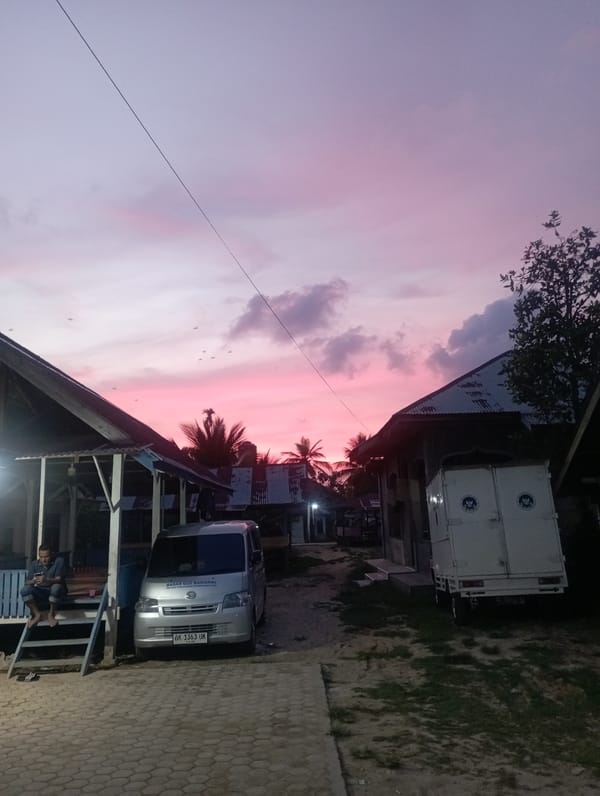 Vibrant pink sunset sky captured in Dayahtuha, Indonesia