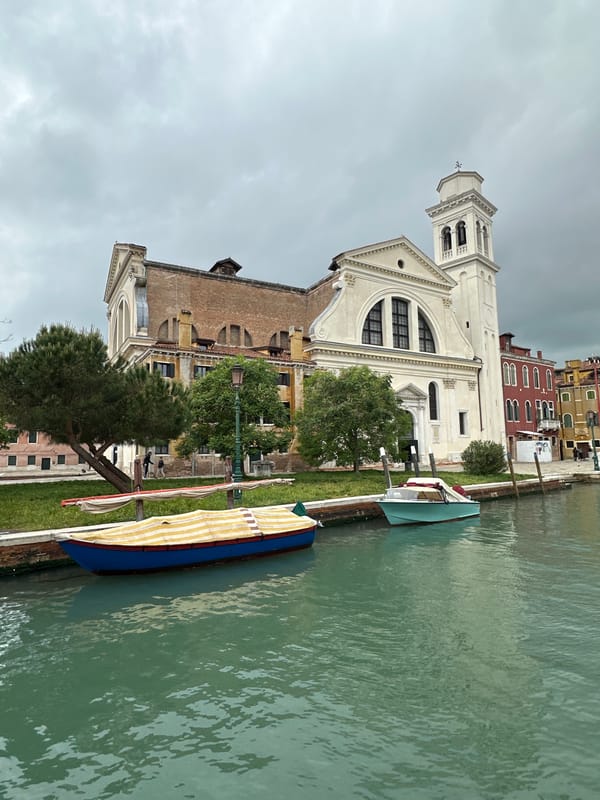 Tourist documents Venice canals and abstract art exhibition