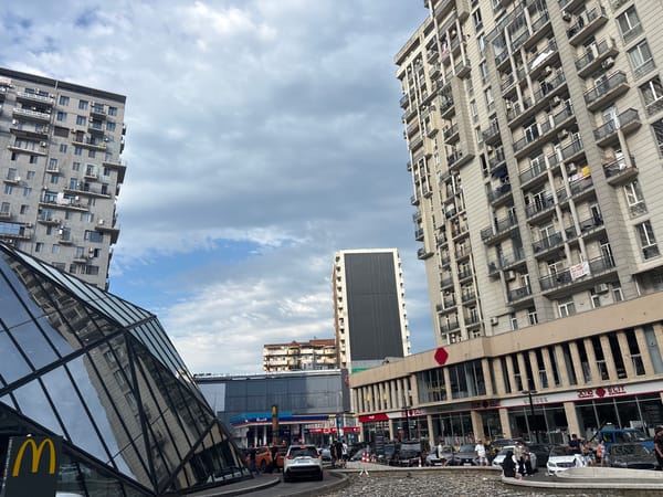 Batumi street life: old blocks, new towers, summer afternoon