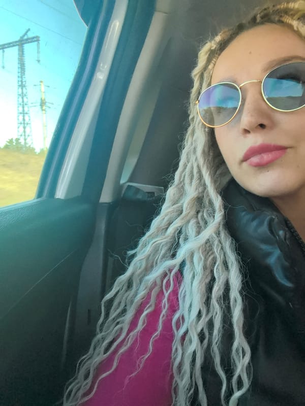 Person with dreadlocks photographed in car in Chaikovsky, Russia