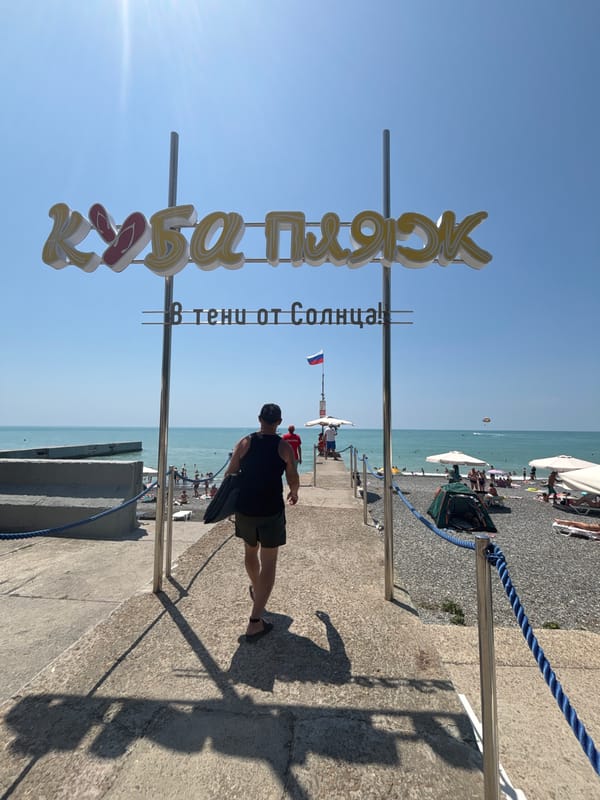Crowded summer day on Sochi's Black Sea pebble beach