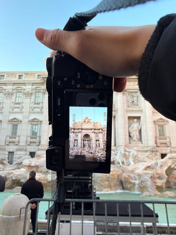 Tourist photographs Trevi Fountain with Sony camera in Rome