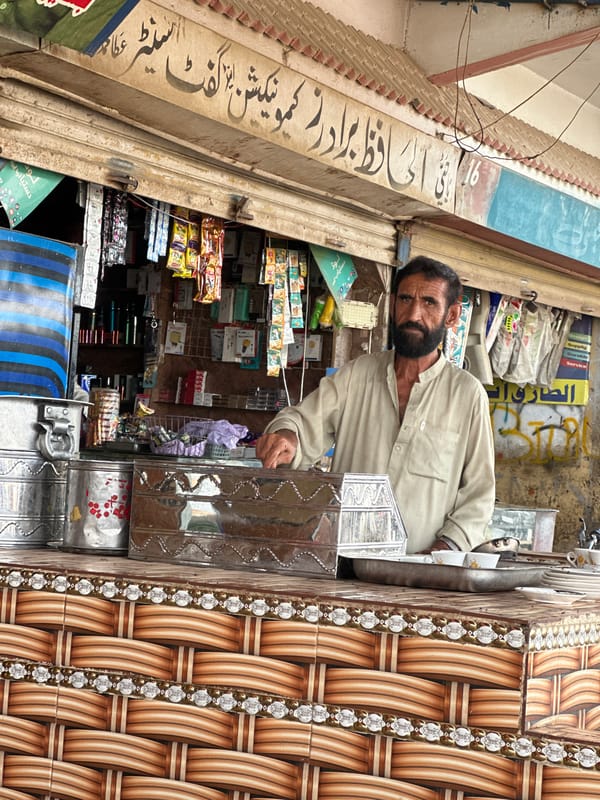 Street-level commerce and traffic in Hub, Pakistan
