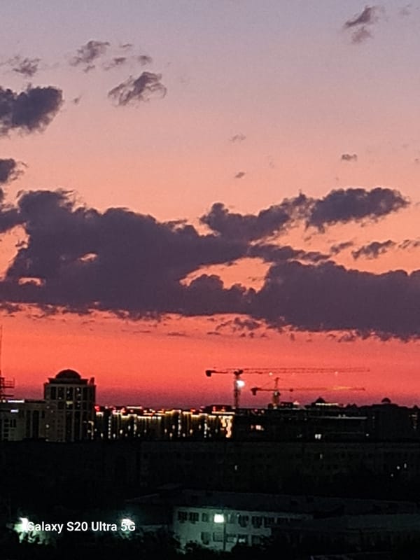 Almaty skyline and Central Mosque glow at twilight