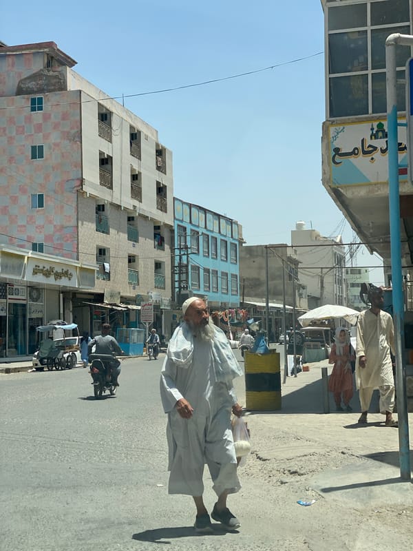 Street vendors and foot traffic fill a Kandahar morning market