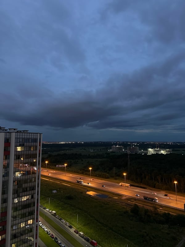 Dusk over Kudrovo's highway corridor, shot from above
