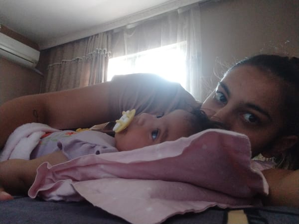 Mother and baby share quiet moment during morning rest