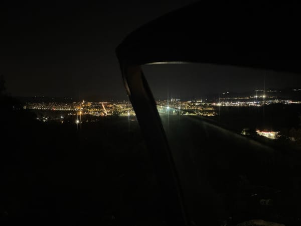 Nighttime lights illuminate Pacs del Penedès from elevated viewpoint