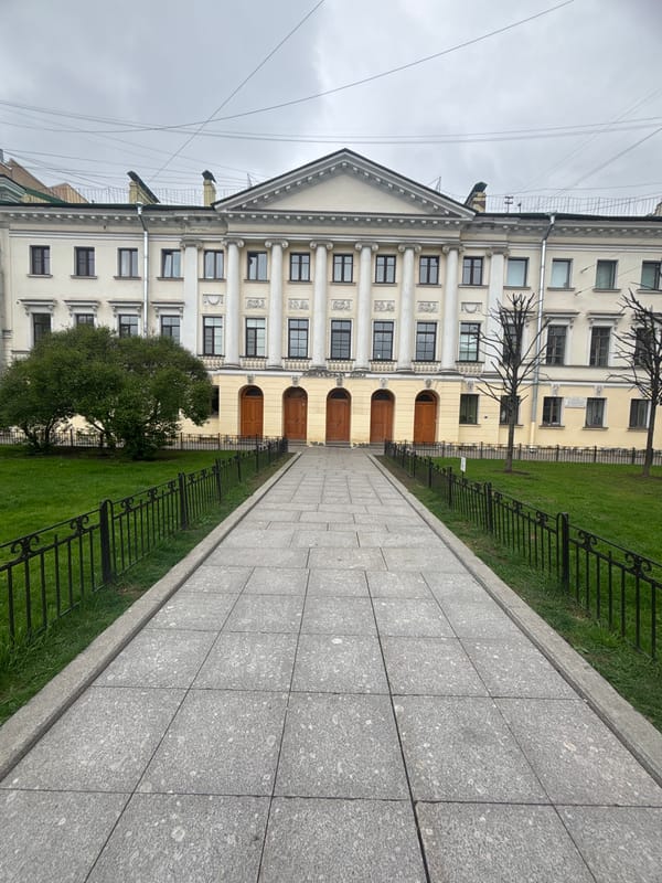 Pedestrian walkway to classical building observed in Saint Petersburg
