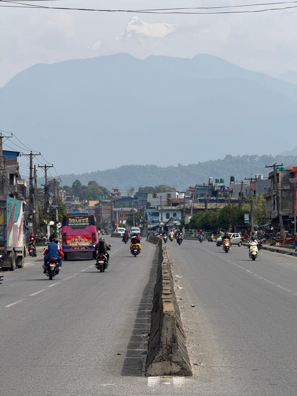 Morning traffic flows through divided streets in Pokhara, Nepal
