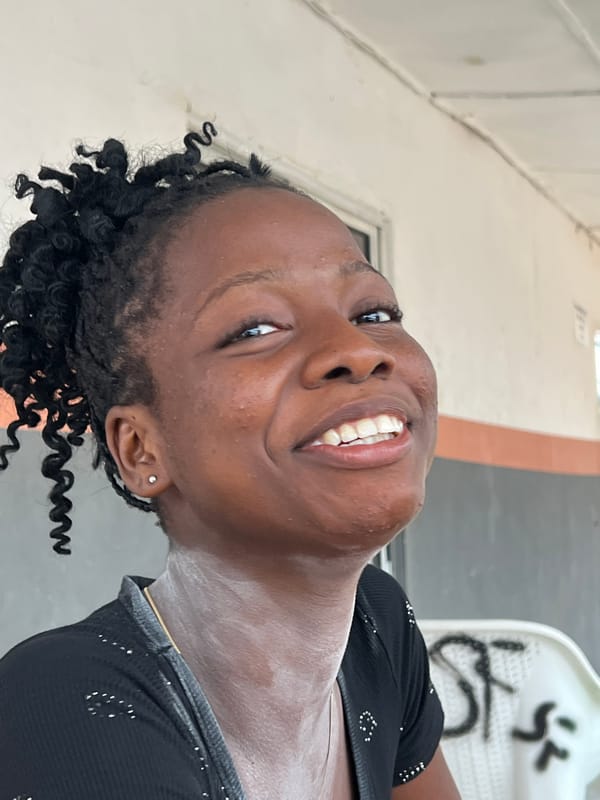 Casual hangout at an Nkpor outdoor spot, WhatsApp contact shared