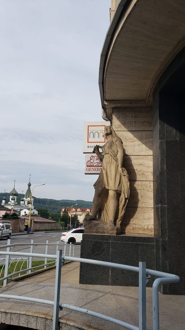 Street-level snapshot of Prešov's churches, buildings, and city life