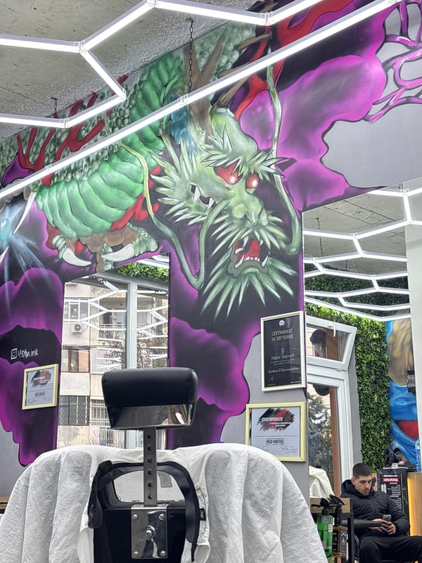 Dragon mural and wooden sculpture spotted in Varna barbershop