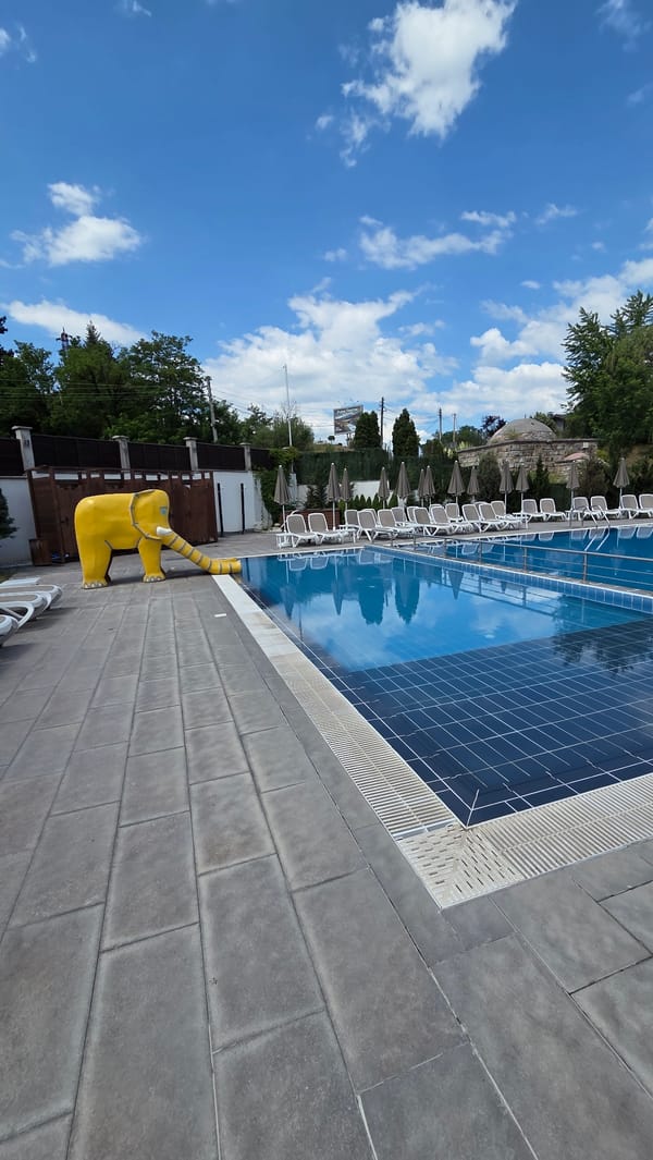 Resort amenities on a quiet morning — pools, bars, and robots
