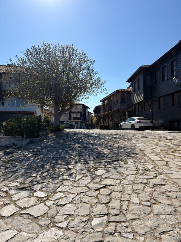Two men photograph casual visit to historic Nesebar, Bulgaria