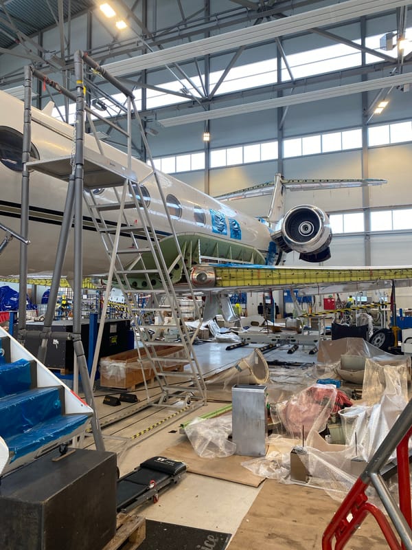 Jet aircraft undergoes maintenance at Skulte, Latvia hangar facility