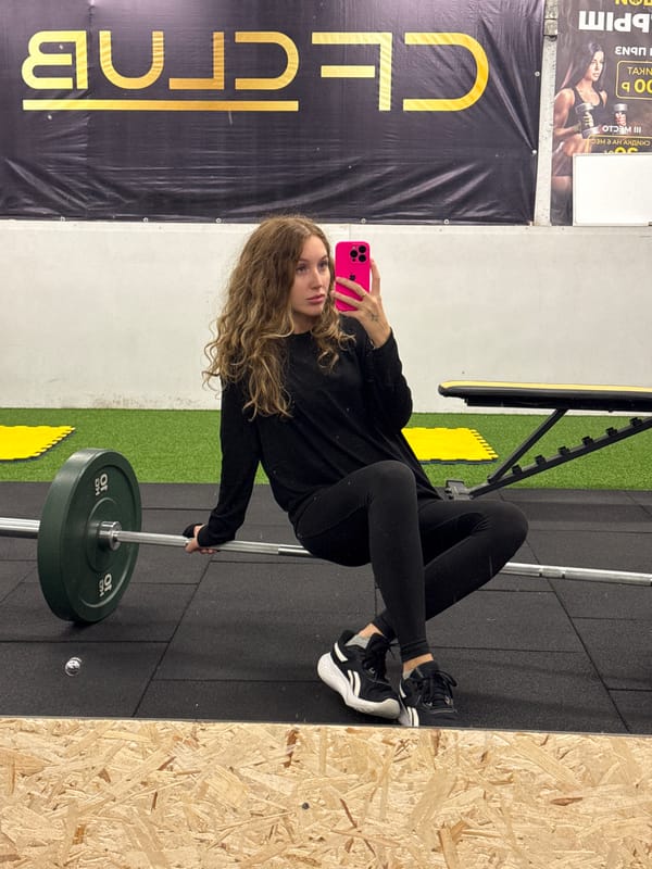 Woman takes mirror selfies at gym in Chaikovsky