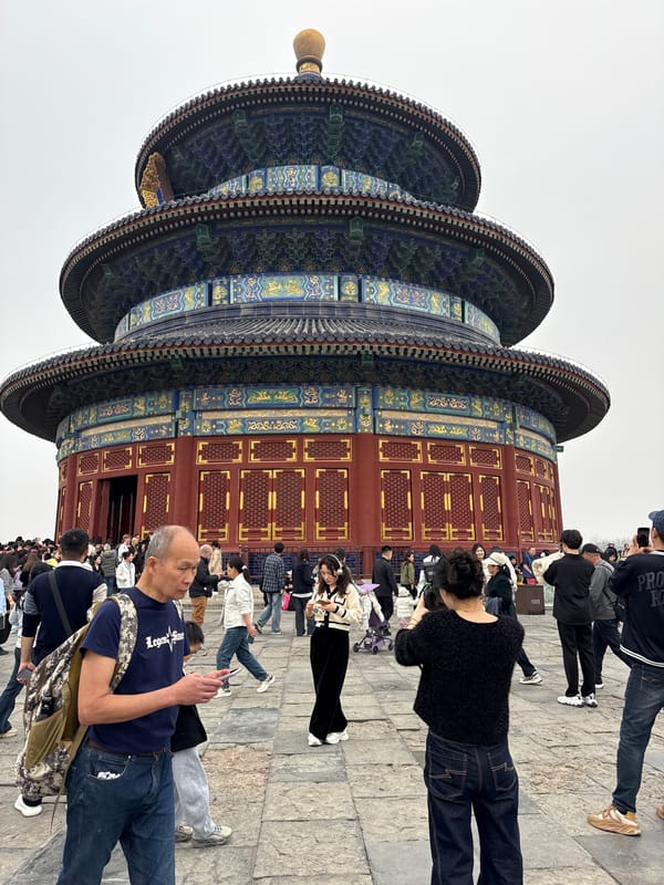 Morning crowds gather at Beijing's Temple of Heaven complex