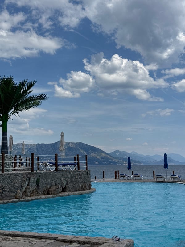 Tourist enjoys poolside relaxation at Montenegro resort