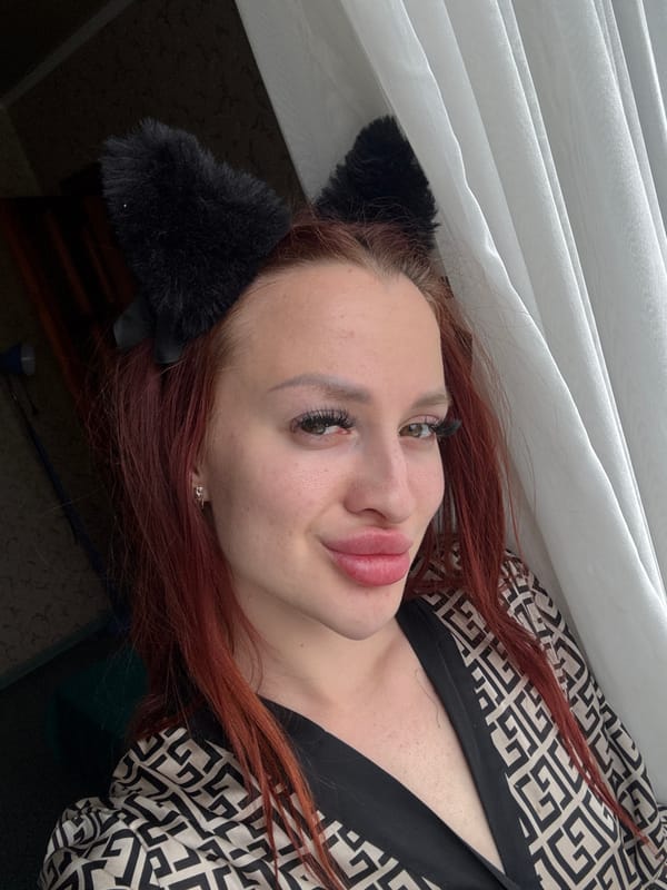 Woman in cat ears photographed in bedroom, Simferopol