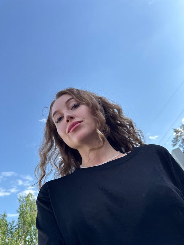 Woman photographed against blue sky in Noviy, Russia