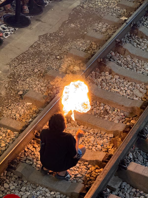 Flare work on Hanoi's famous Train Street tracks